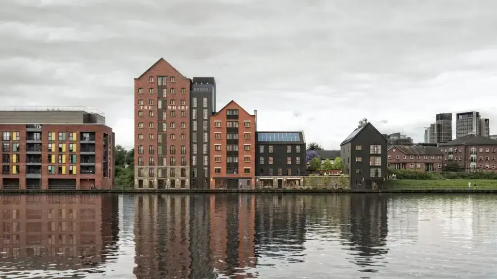Modern buildings along a calm river.