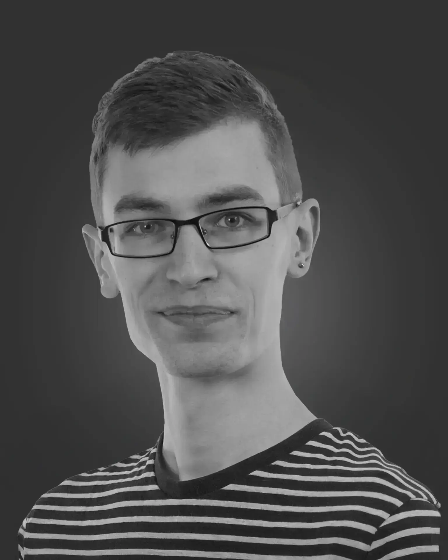 Person in striped shirt, neutral background.