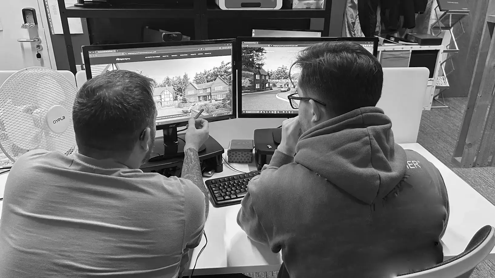 Two people working at computers